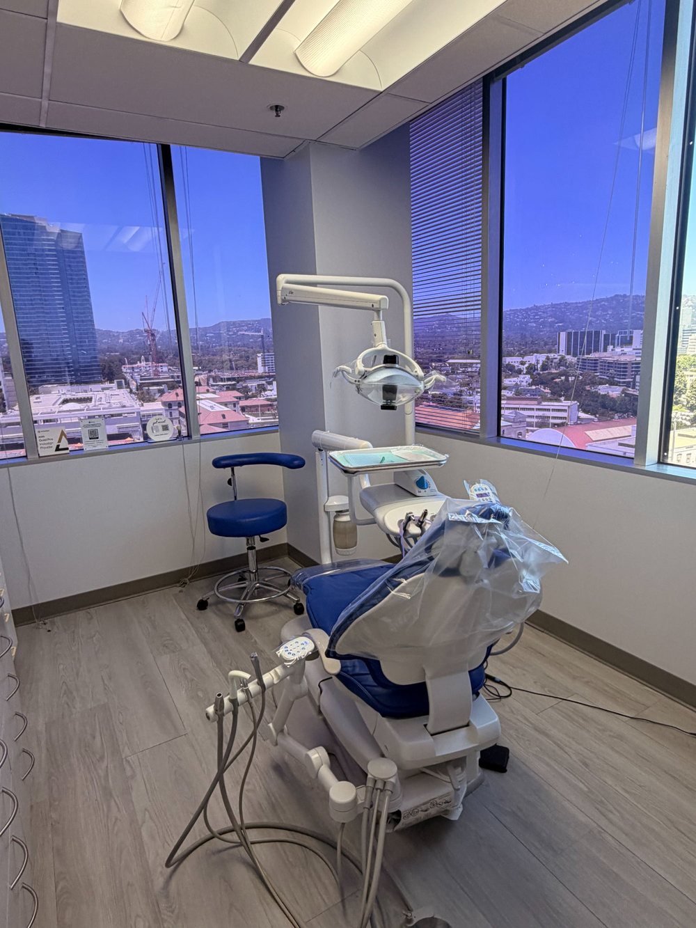 Modern dental operatory with city views at Century Smile Maker